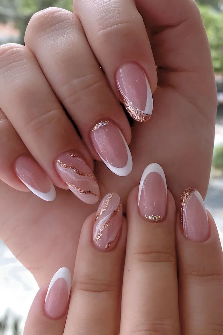 Almond French manicure with gold swirl accents