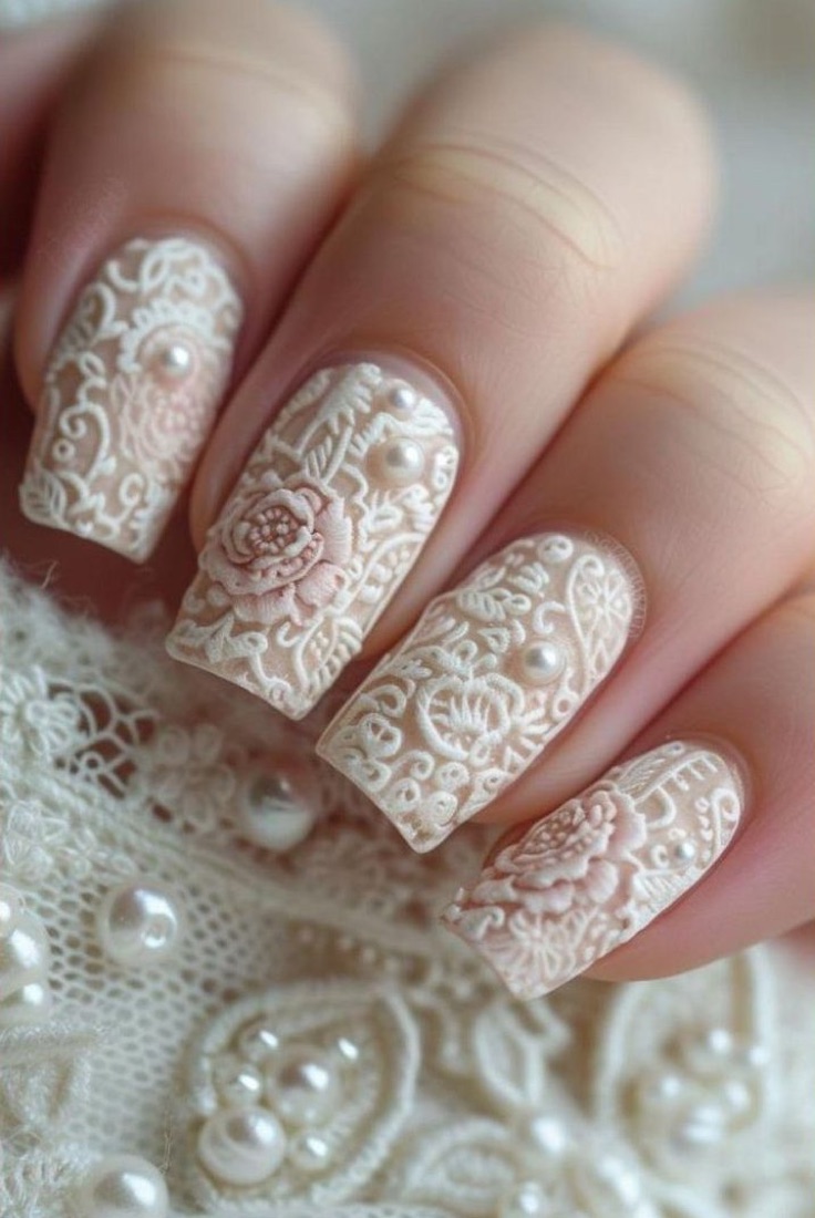 White lace-effect nails with pearl details