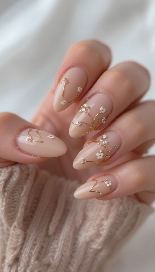 Nude nails with fine gold vine details